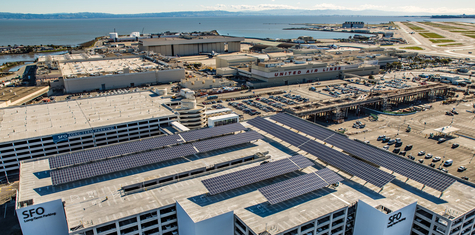 REC solar panels installed on commercial rooftop at SFO airport helps business reduce energy bills and make a positive impact on climate change