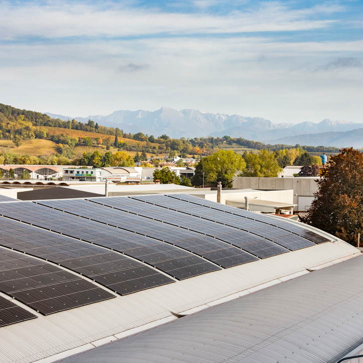 REC solar panels installed on commercial rooftop in Italy helps business reduce energy bills and make a positive impact on climate change