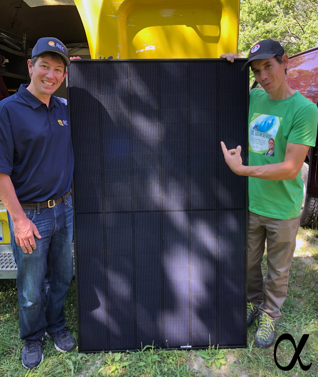Alex Honnold (R) and Cary Hayes, President of REC Americas (L), with the award-winning REC Alpha Black solar panel